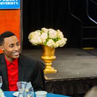 Guests sitting at a table in front of a podium at Scholarship Dinner 2019